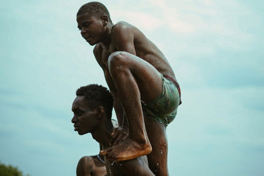 a-man-holding-a-child-in-water.jpg a man holding a child in water